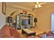 Living room with hardwood floors, brown leather couch, and entertainment center at 3555 Maribella Dr, New Smyrna Beach, FL 32168