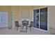 Relaxing patio with fireplace and seating area at 3555 Maribella Dr, New Smyrna Beach, FL 32168
