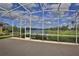 Large screened lanai with lake view at 3555 Maribella Dr, New Smyrna Beach, FL 32168