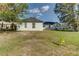 House's rear elevation showing a large yard at 762 Toulon Dr, Kissimmee, FL 34759