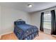Bedroom with a full-size bed and window at 762 Toulon Dr, Kissimmee, FL 34759