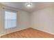 Simple bedroom with wood flooring and window at 762 Toulon Dr, Kissimmee, FL 34759