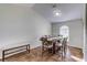 Bright dining room with a wooden table and bench seating at 762 Toulon Dr, Kissimmee, FL 34759