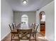 Charming dining room with a rustic wooden table and seating for six at 762 Toulon Dr, Kissimmee, FL 34759