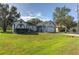 Front view of a single-story house with a spacious lawn at 762 Toulon Dr, Kissimmee, FL 34759
