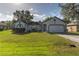 Cute one-story house with a well-maintained lawn and attached garage at 762 Toulon Dr, Kissimmee, FL 34759