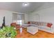 Living room with sectional sofa and tile flooring at 762 Toulon Dr, Kissimmee, FL 34759