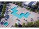 Resort-style pool with multiple lounging areas and a spa at 7760 Sandy Ridge Dr # 222, Kissimmee, FL 34747