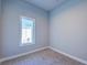 Small bedroom with light blue walls and a window at 7760 Sandy Ridge Dr # 222, Kissimmee, FL 34747