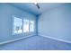 Bright bedroom with large windows and neutral walls at 7760 Sandy Ridge Dr # 222, Kissimmee, FL 34747