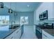 Modern kitchen with stainless steel appliances and breakfast bar at 7760 Sandy Ridge Dr # 222, Kissimmee, FL 34747