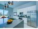 Modern kitchen with stainless steel appliances and breakfast bar at 7760 Sandy Ridge Dr # 222, Kissimmee, FL 34747