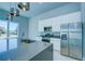 Modern kitchen with stainless steel appliances and a large island at 7760 Sandy Ridge Dr # 222, Kissimmee, FL 34747
