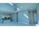 Open concept living area with high ceilings, kitchen island, and loft area at 7760 Sandy Ridge Dr # 222, Kissimmee, FL 34747