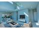 Open living area with high ceilings, modern furniture and kitchen island at 7760 Sandy Ridge Dr # 222, Kissimmee, FL 34747