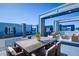 Relaxing rooftop patio furnished with comfortable seating and dining area at 7760 Sandy Ridge Dr # 222, Kissimmee, FL 34747
