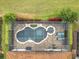 Bird's eye view of a lovely screened pool and spa at 8914 Dove Valley Way, Davenport, FL 33896
