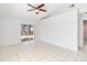 Bright bedroom with sliding door to patio and ceiling fan at 9808 Flynt Cir, Orlando, FL 32825