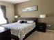 Spacious main bedroom with a plush bed and ample natural light at 9004 Shine Dr, Kissimmee, FL 34747