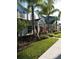 Attractive townhouses with lush landscaping and a convenient sidewalk at 9004 Shine Dr, Kissimmee, FL 34747