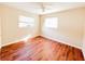 Bright bedroom featuring wood-look floors and ceiling fan at 1403 Amaros Ave, Orlando, FL 32811