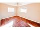 Spacious bedroom with wood-look flooring and window at 1403 Amaros Ave, Orlando, FL 32811