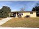 Ranch-style house with carport and neat lawn at 1403 Amaros Ave, Orlando, FL 32811