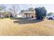 House with covered porch and well-maintained lawn at 1403 Amaros Ave, Orlando, FL 32811