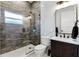 Modern bathroom with a walk-in shower, marble vanity and stylish fixtures at 1606 Hart Ln, Orlando, FL 32804