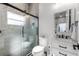 Modern bathroom with a walk-in shower, floating vanity, and stylish fixtures at 1606 Hart Ln, Orlando, FL 32804
