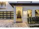 Inviting entryway with a modern door and stylish light fixtures at 1606 Hart Ln, Orlando, FL 32804