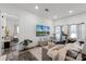 Bright living room featuring a large TV and comfortable seating at 1606 Hart Ln, Orlando, FL 32804