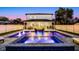 Night view of the pool, spa and outdoor entertaining area at 1606 Hart Ln, Orlando, FL 32804