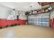Attached garage with overhead storage and epoxy flooring at 1801 Lobelia Dr, Lake Mary, FL 32746