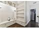 Built-in white shelving unit with drawers and decorative accents at 1801 Lobelia Dr, Lake Mary, FL 32746