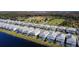 Aerial view of a community with houses and pools at 2477 Shanti Dr, Kissimmee, FL 34746