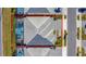 Aerial view of a house with a pool and screened enclosure at 2477 Shanti Dr, Kissimmee, FL 34746