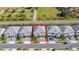Aerial view of a house with a two-car garage and landscaped yard at 2477 Shanti Dr, Kissimmee, FL 34746