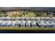 Aerial view of a community with houses and pools at 2477 Shanti Dr, Kissimmee, FL 34746