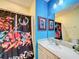 Themed bathroom with Thundercats shower curtain and decor at 2477 Shanti Dr, Kissimmee, FL 34746