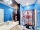 Bathroom with Star Wars themed shower curtain at 2477 Shanti Dr, Kissimmee, FL 34746