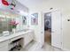 Mickey Mouse themed bathroom with double vanity and access to bedroom at 2477 Shanti Dr, Kissimmee, FL 34746