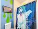 Bathroom with Ghostbusters themed shower curtain and decor at 2477 Shanti Dr, Kissimmee, FL 34746