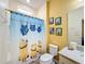 Minion-themed bathroom with fun shower curtain at 2477 Shanti Dr, Kissimmee, FL 34746