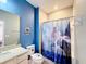 Bathroom with Frozen themed shower curtain at 2477 Shanti Dr, Kissimmee, FL 34746