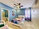 Bedroom with Frozen-themed bedding and en-suite bathroom at 2477 Shanti Dr, Kissimmee, FL 34746