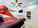 Themed bedroom with Thundercats decor and en-suite bathroom at 2477 Shanti Dr, Kissimmee, FL 34746