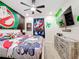 Ghostbusters themed bedroom with king-size bed and TV at 2477 Shanti Dr, Kissimmee, FL 34746