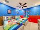 Super Mario themed bedroom with twin beds and wall art at 2477 Shanti Dr, Kissimmee, FL 34746