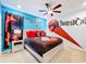 Themed bedroom with Thundercats decor and en-suite bathroom at 2477 Shanti Dr, Kissimmee, FL 34746
